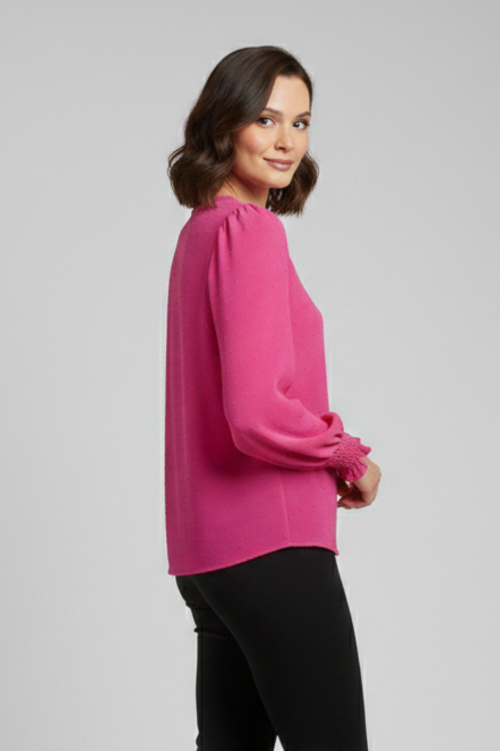 Women's long sleeve blouse showcasing detailed embroidery, round neck, button placket, and elasticated cuffs.
