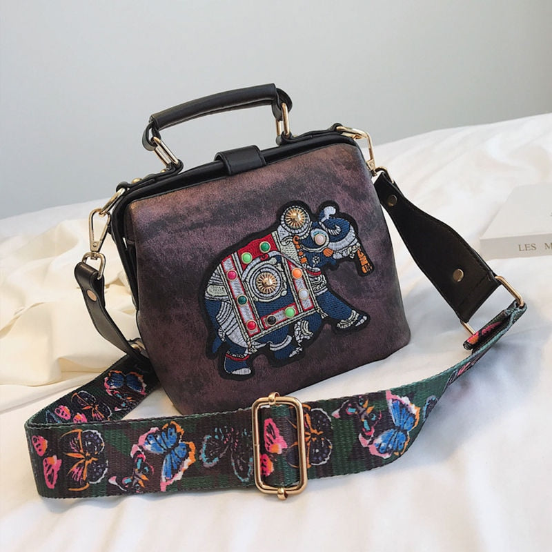 Women's versatile shoulder bag with bohemian mandala embroidery, a lightweight cotton accessory.
