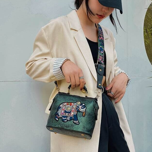 Bohemian fashion accessory: women's lightweight embroidered mandala shoulder bag with hasp closure.