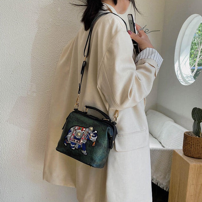 Lightweight bohemian embroidered mandala shoulder bag for women, multi-use accessory with hasp closure.