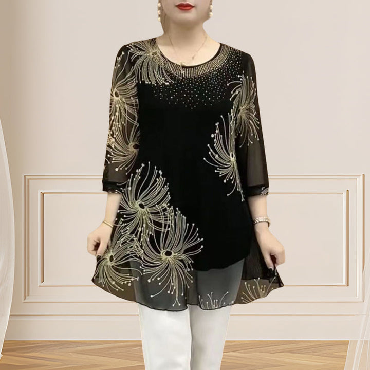 Model wearing a women's embroidered mesh round neck t-shirt with 3/4 sleeves