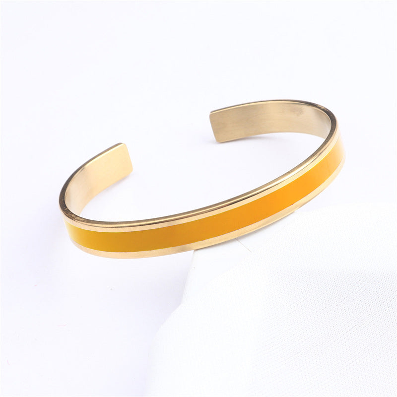 Close-up of engraving on a women's stainless steel bangle, clear text, quality craftsmanship