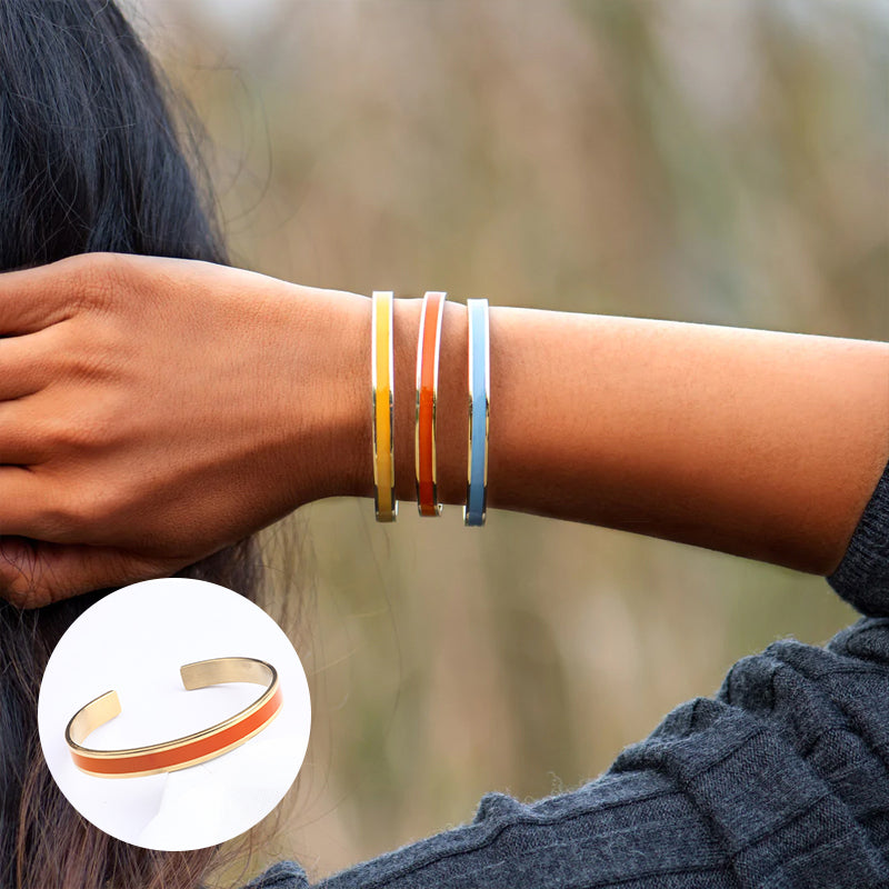 Close-up of a women's stainless steel bangle, polished finish, 'Love' engraved, ideal wrist accessory