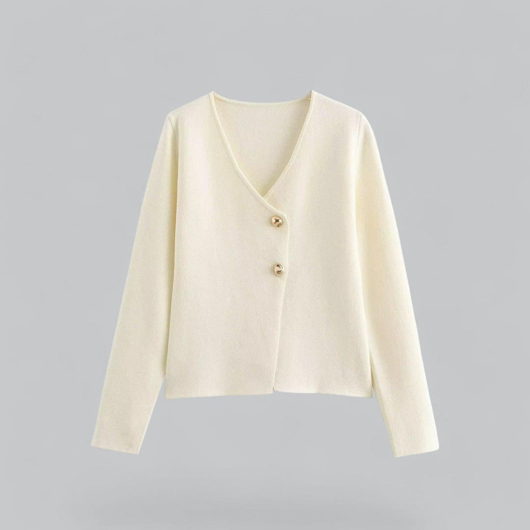 Close-up of a women's essential button cardigan, highlighting the soft knit texture and button detail.