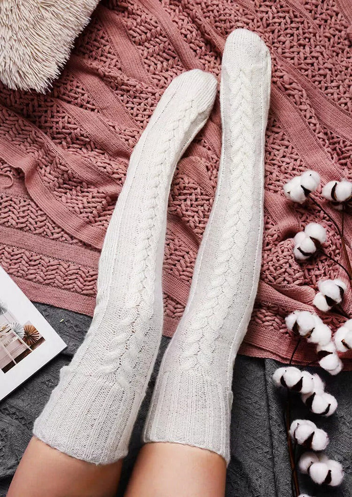 Fashionable women's over-knee socks, knitted extra long for warmth and comfort during cold winter days.