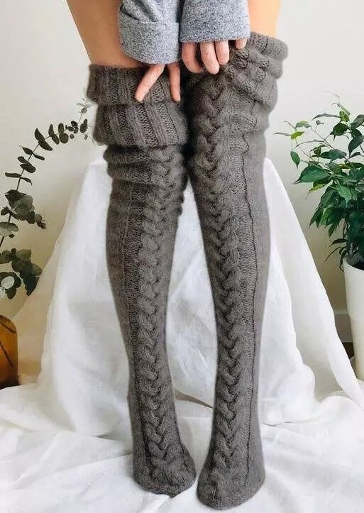 Soft, warm, and extra long knitted over-knee socks for women, an essential clothing item for winter.