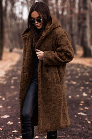 Close-up of the soft faux fur hood on a women's warm winter parka jacket, cozy detail
