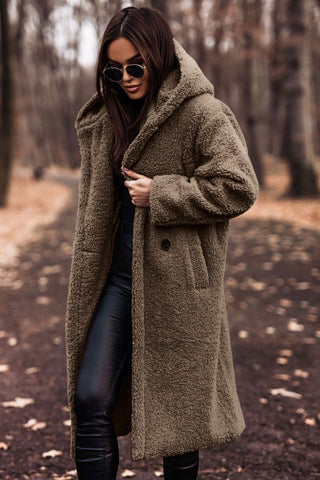 Back view of a women's fashion winter parka coat with a drawstring waist for a flattering fit