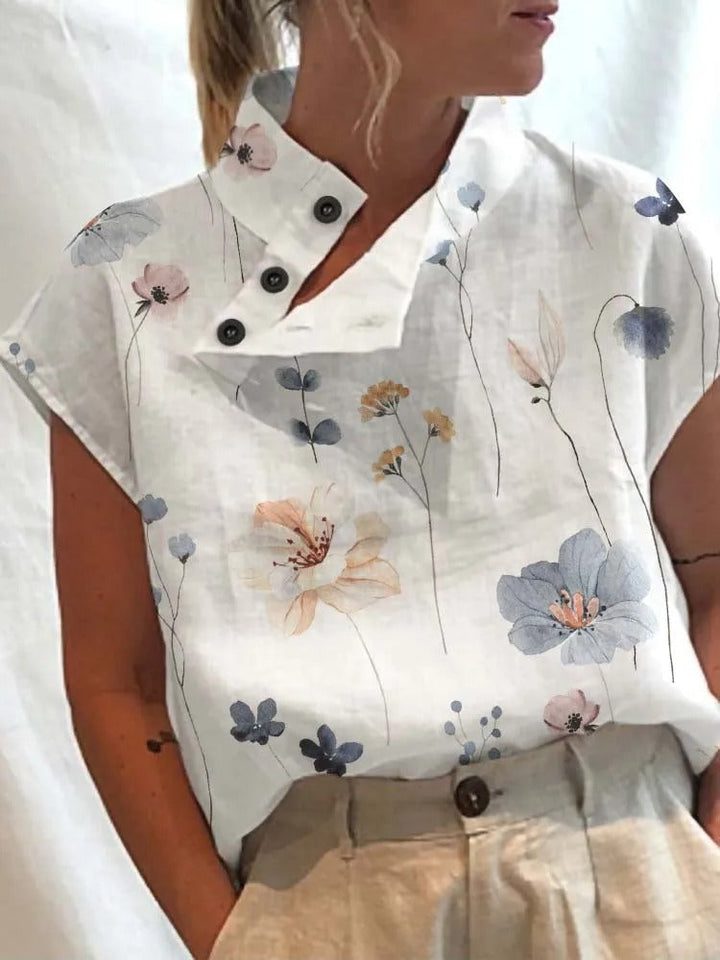 Trendy women's short sleeve floral top with delicate dragonfly print, a comfortable and versatile summer blouse.