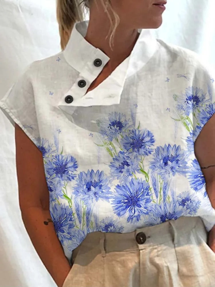 Comfortable women's short sleeve blouse, Felicia, featuring a vibrant playful print for trendy casual or office outfits.