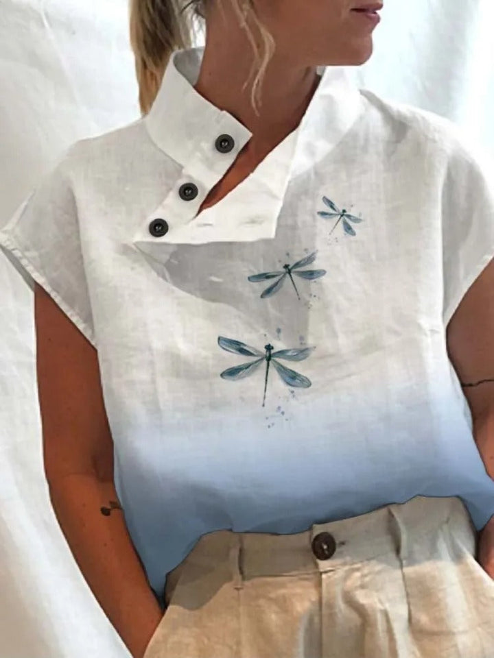 Charming women's short sleeve top with a unique playful print, ideal for a stylish summer fashion look.