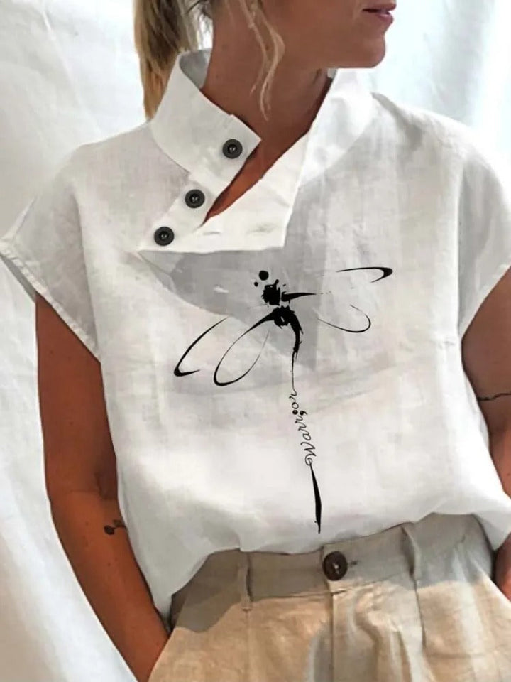 Stylish women's summer short sleeve blouse, Felicia, showcasing a unique playful print for a trendy look.
