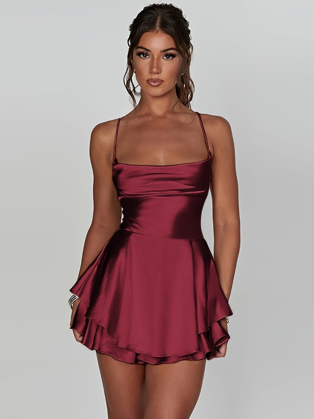 Women's fitted ruched mini homecoming dress with a stylish tiered skirt.