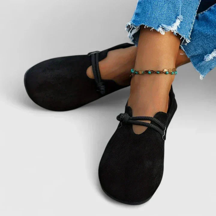 Casual women's slip-on flat loafers featuring a unique rope tie design, comfortable everyday footwear.