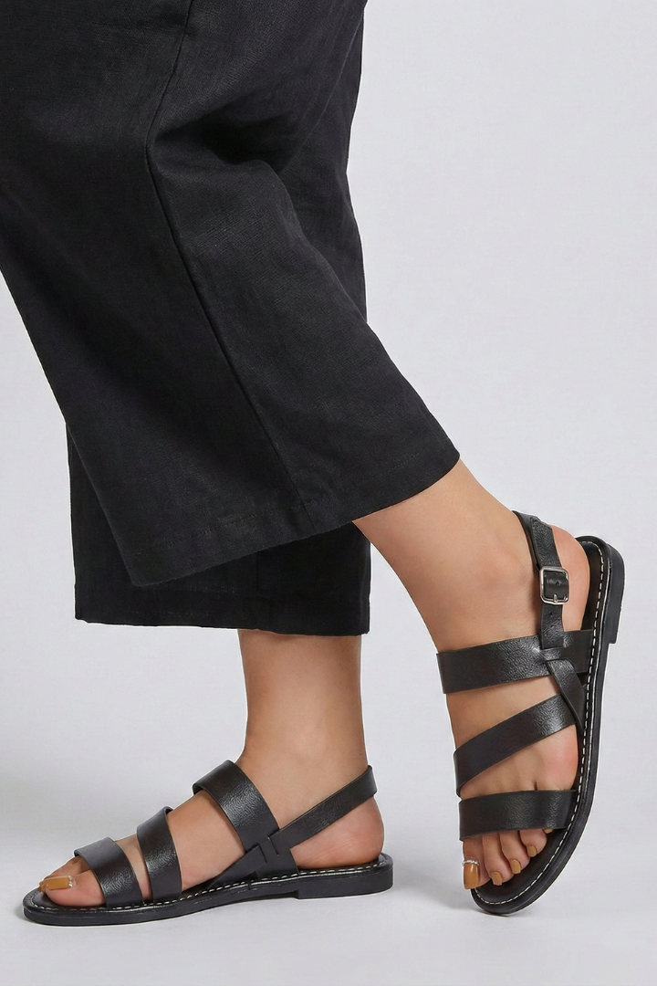 Stylish women's flat sandals, perfect for casual wear, with an adjustable back strap.