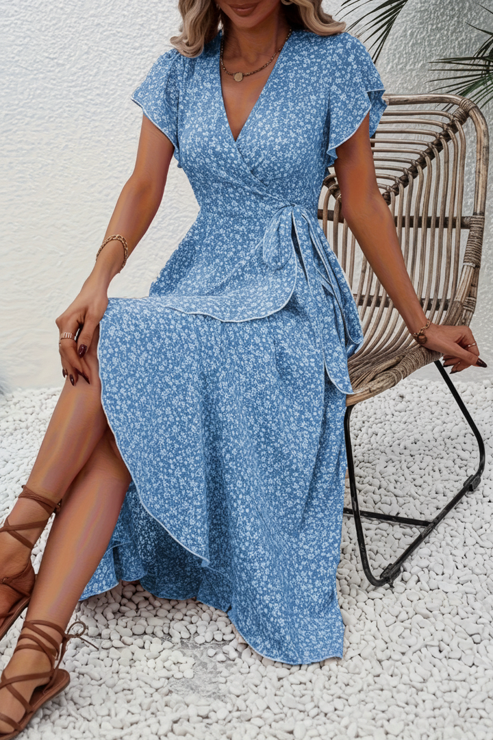Chic women's V-neck short sleeve summer dress, floral print, flattering and versatile for elegant occasions.