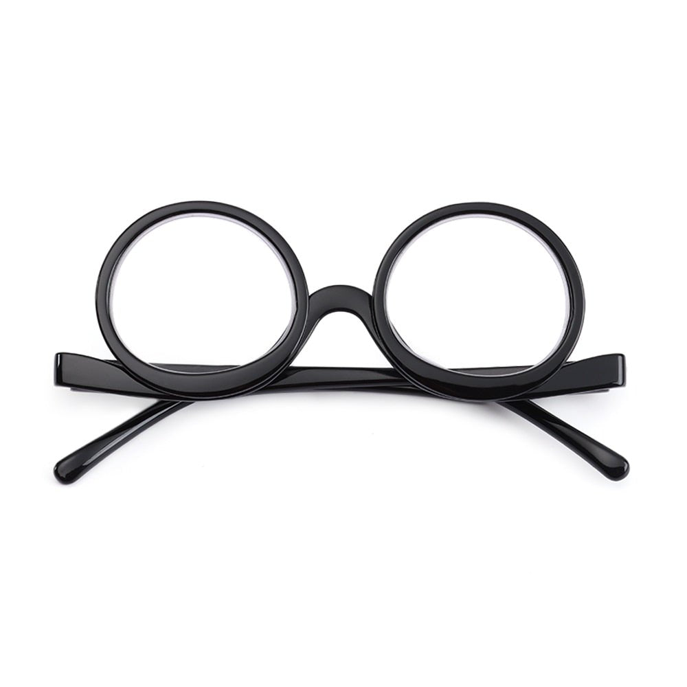 Side profile of women's precision flip-down magnifying glasses, ergonomic design for makeup application.
