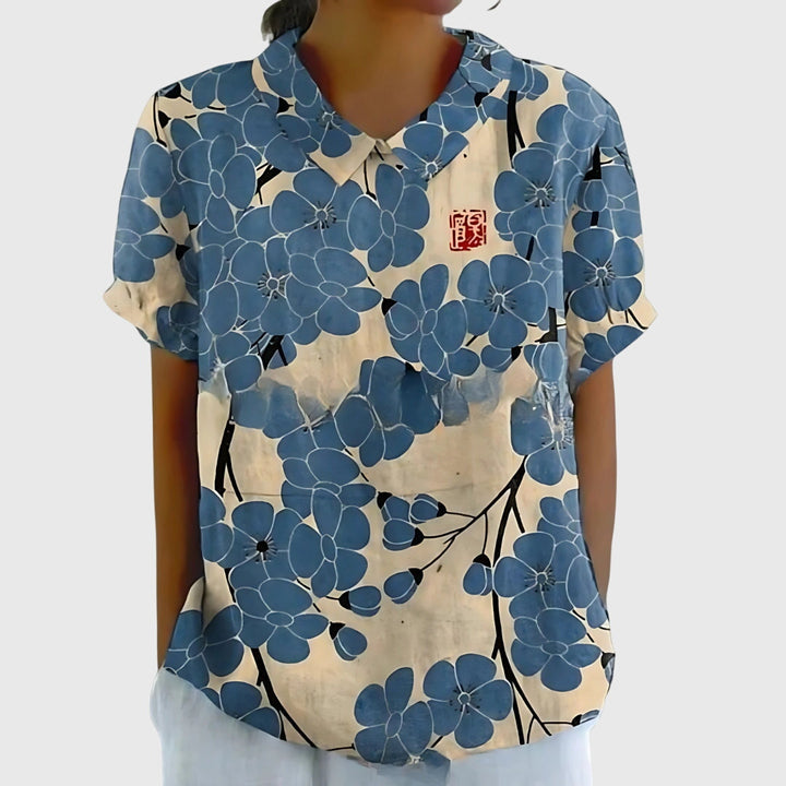 Versatile women's floral blouse paired with jeans, creating an effortless everyday fashion look.