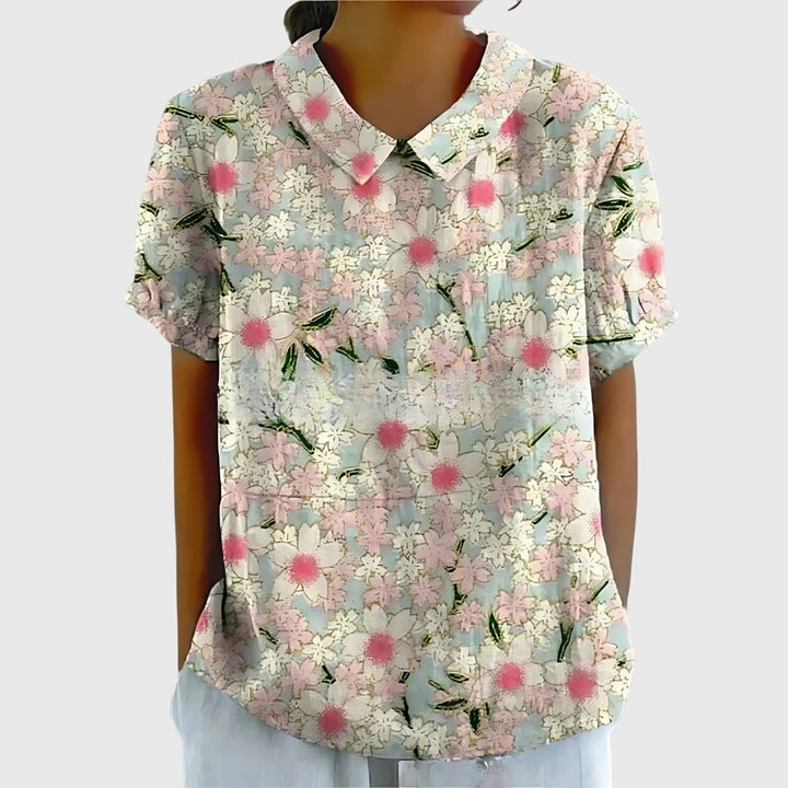 Feminine floral top styled with a skirt, a stylish and comfortable option for women's fashion.