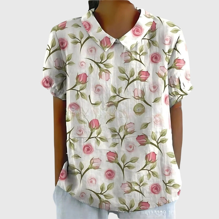 Full length front view of a women's floral blouse, a stylish & versatile spring/summer fashion top.