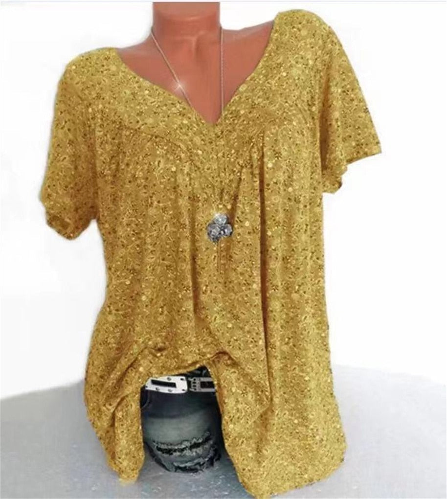 Chic women's floral summer blouse, featuring an empire waist and elegant flutter sleeves.