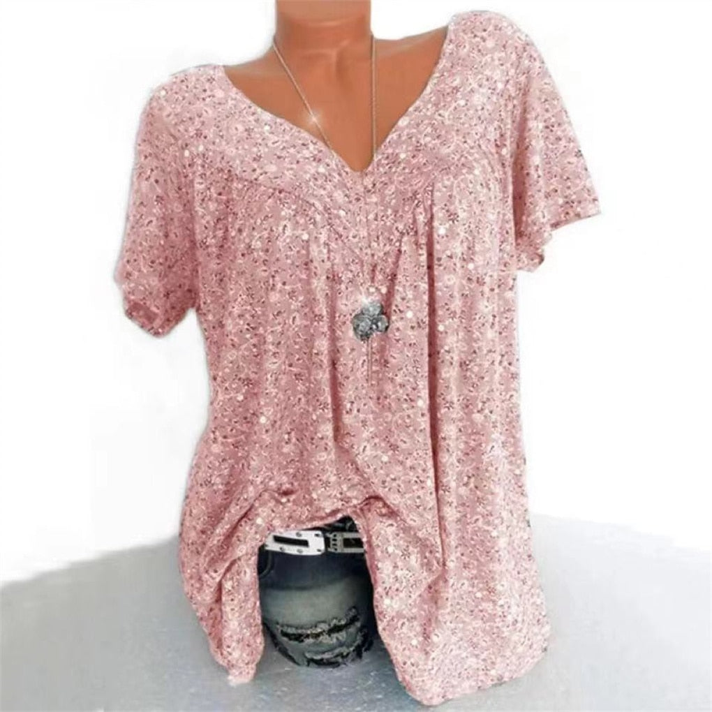 Stylish women's empire waist blouse, floral pattern, V-neck, and chic flutter sleeves.