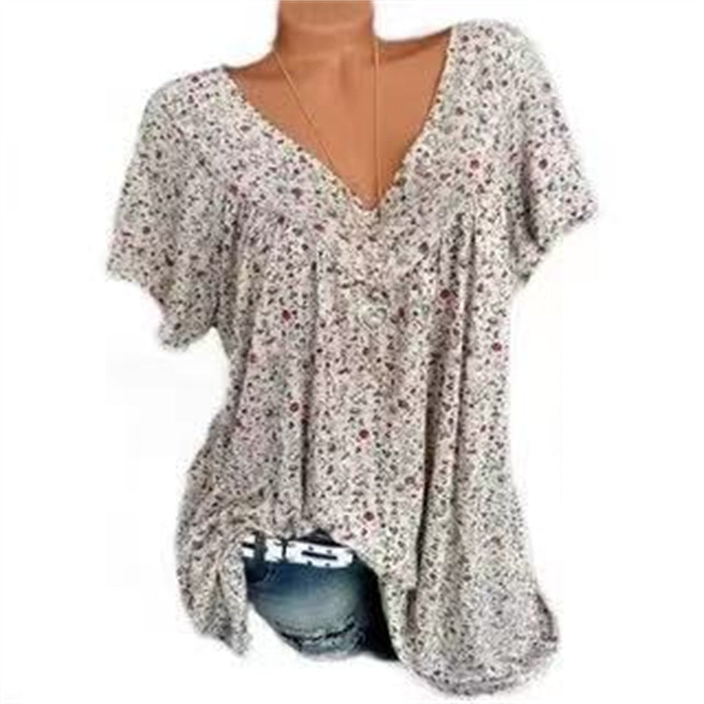 Casual women's floral print V-neck shirt with flowy flutter sleeves for summer fashion.