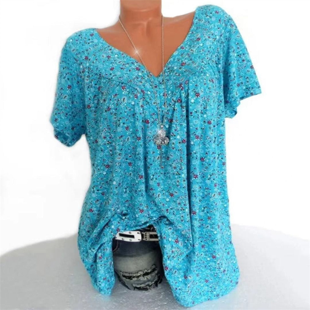 Boho floral blouse for women with a flattering V-neck and airy flutter sleeves, relaxed fit.