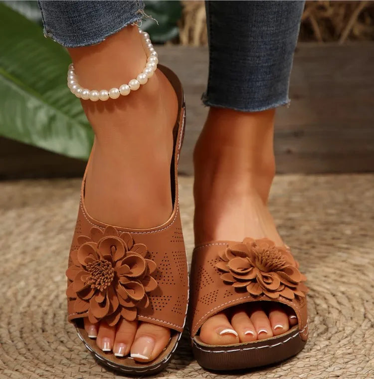Comfortable women's slip-on sandals featuring a beautiful array of colorful floral decorations