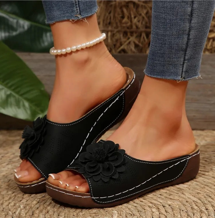 Woman wearing Women's Floral Comfort Slide Sandals on a sunny day, casual and fashionable footwear