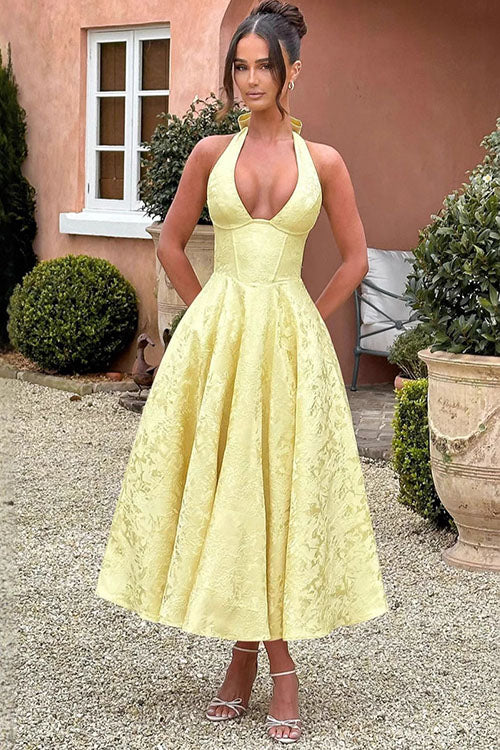 Romantic floral midi dress with halter neck, corset detail, for summer celebrations.
