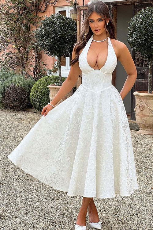 Women's wedding guest floral midi dress, sophisticated & fashionable, halter style.