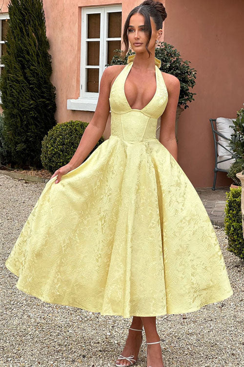 Chic floral print midi dress with corset bodice & halter neck for wedding guests.