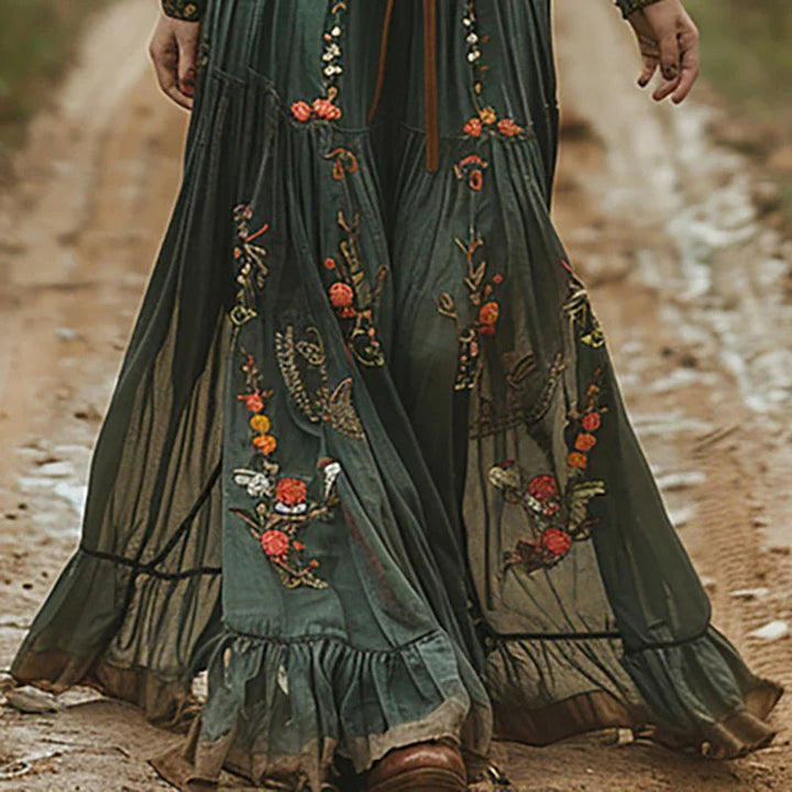 Elegant long women's floral embroidered maxi dress, a stylish summer boho outfit for festivals or vacation.