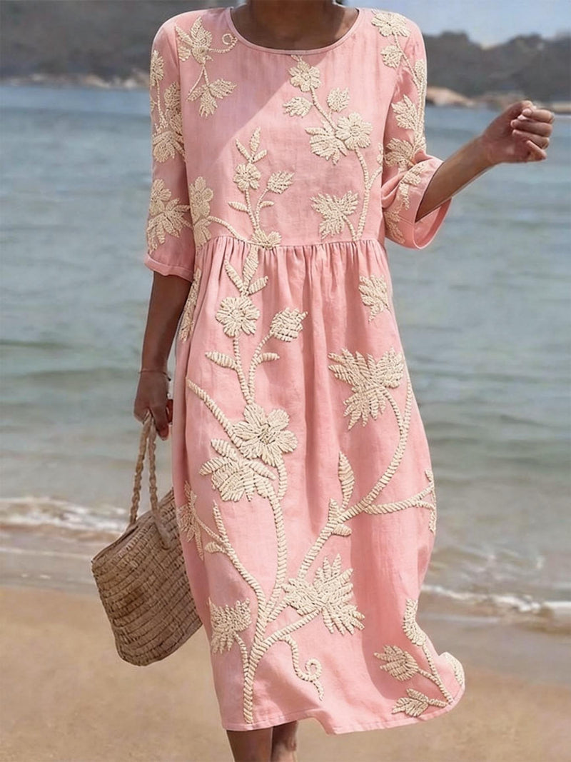 Comfortable women's maxi dress featuring intricate floral embroidery, a flowing fit, three-quarter sleeves. Casual chic.