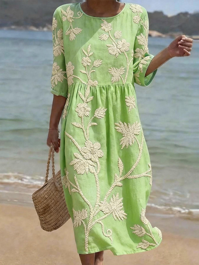 Spring/Summer women's maxi dress. Floral embroidery, flowing fit, round neck & three-quarter sleeves for elegant style.