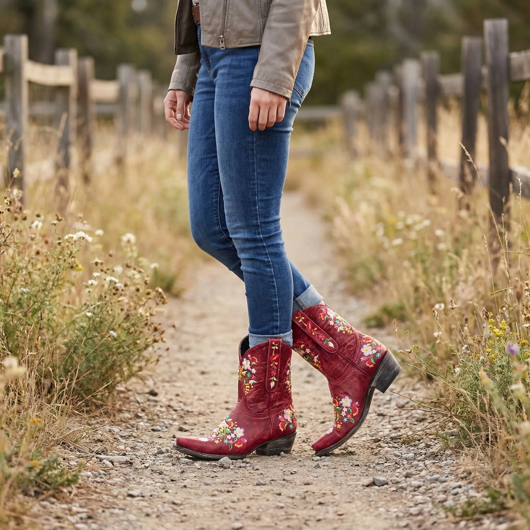 Women's floral embroidered western ankle boots with pointed toe & block heel, perfect for country chic style.