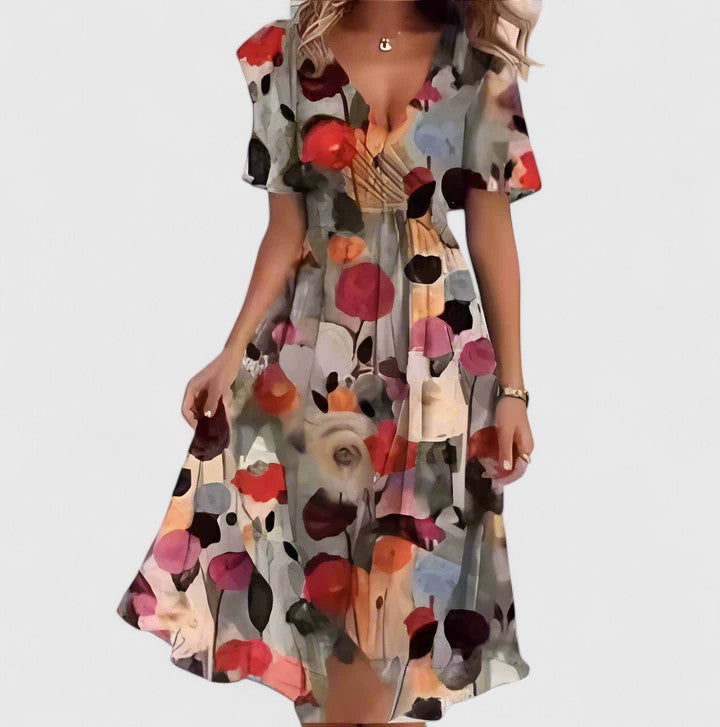 Spring/summer women's floral midi dress. Flutter sleeves, V-neck, cinched waist. Great for garden parties.