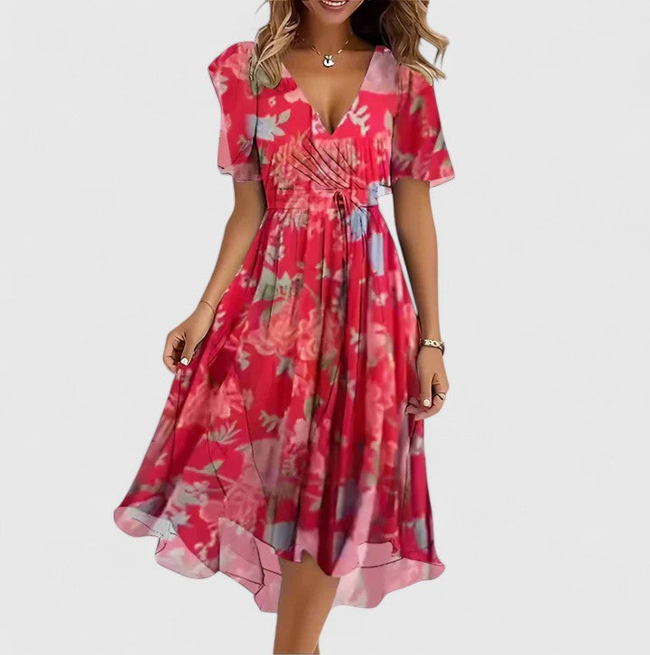 Women's floral midi dress with flutter sleeves, V-neck, & cinched waist. Perfect for everyday spring/summer.