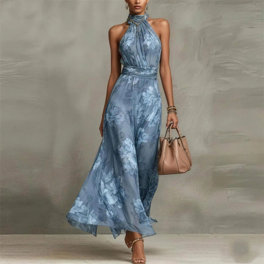 Vibrant floral print women's maxi dress featuring a stylish halter neck. Ideal for summer, resort, or vacation.