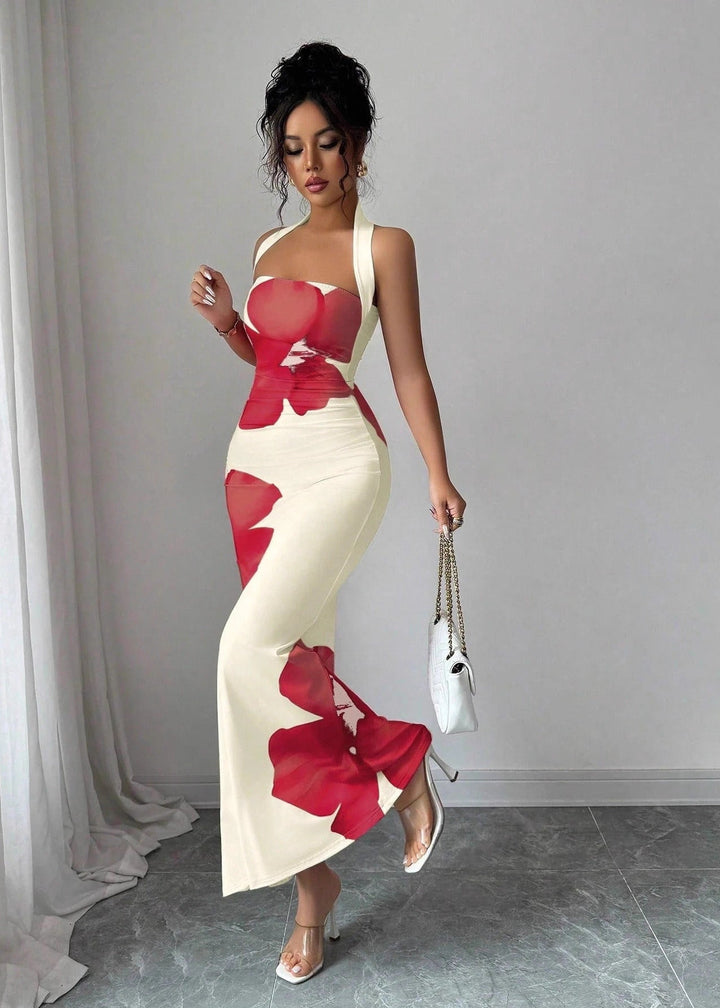 Women's floral halter neck maxi dress with elegant column silhouette, perfect for summer resort wear or special occasions.