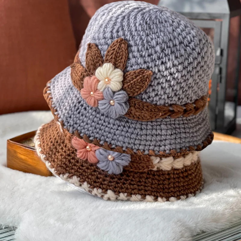Women wearing a floral knit wool beanie outdoors, stylish winter accessory