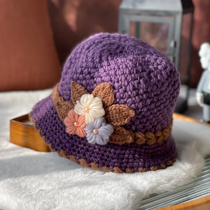 Front view of a women's floral knit beanie, comfortable winter accessory