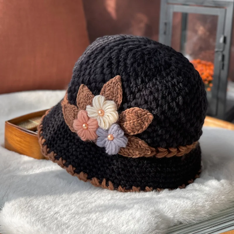 Detailed shot of the wool texture and floral stitching on a women's beanie
