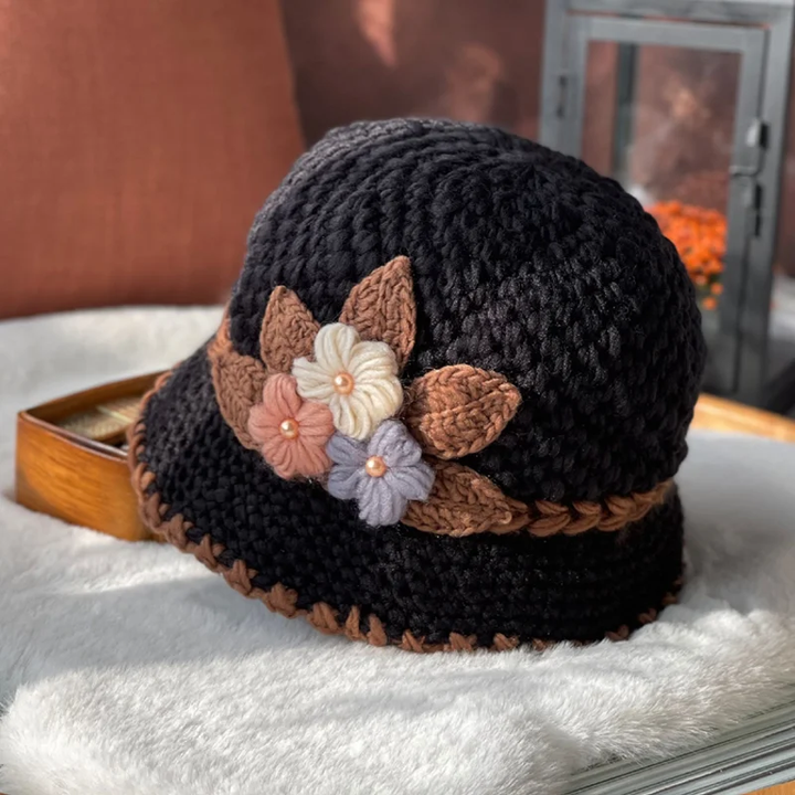 Detailed shot of the wool texture and floral stitching on a women's beanie