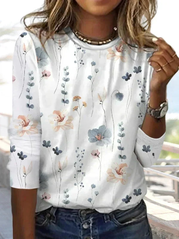 Women's floral knitted top with round neck. Comfortable & versatile for spring/autumn casual elegance.