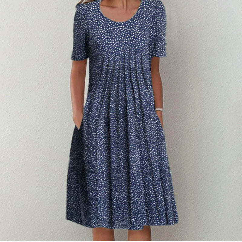 Women's casual floral midi dress with convenient pockets, short sleeve, comfortable for everyday spring fashion.