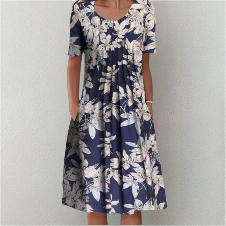 Effortless spring fashion: Women's floral midi dress, short sleeve, comfortable, with pockets for everyday style.