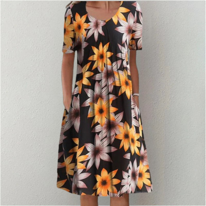 Women's casual floral midi dress with short sleeves, round neck, and practical pockets for comfort and style.