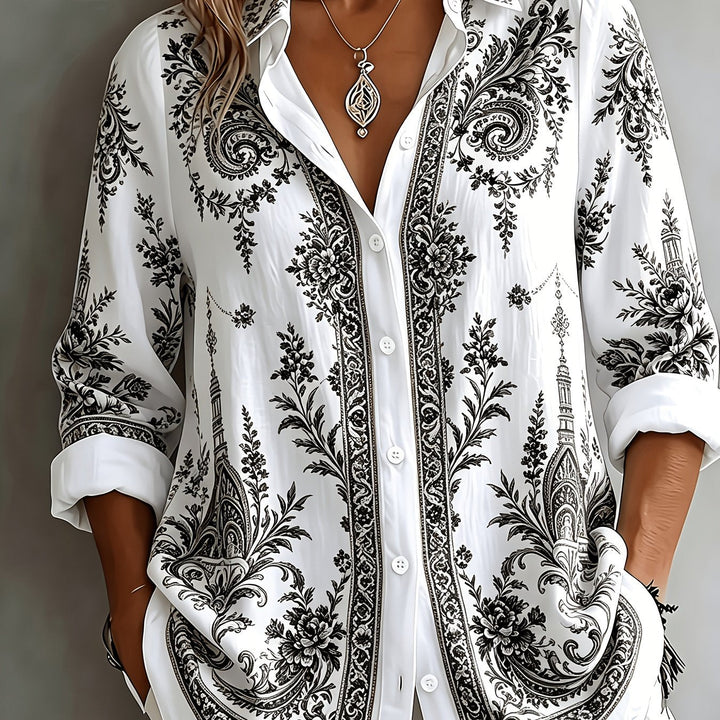 Stylish women's oversized long sleeve blouse, button-down, in a vibrant floral paisley.